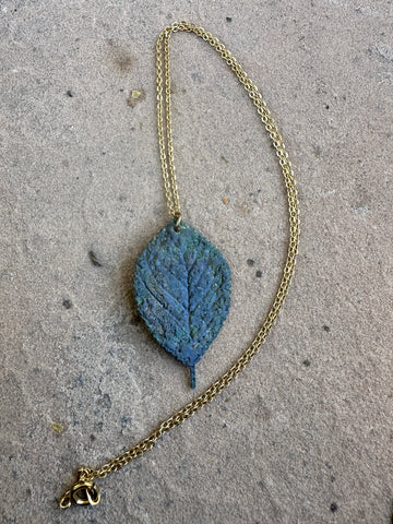 Yellow gold, brass locket, moldavite leaf pendant 18” necklace